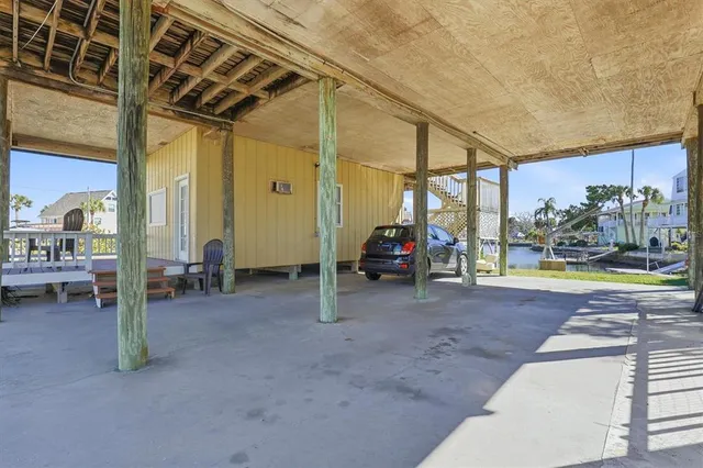 a view of a balcony with wooden floor and city view