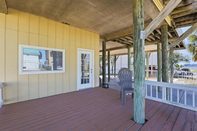 a bedroom with a bed and a large mirror