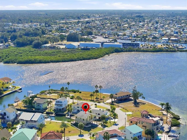 a living room with dining table and wooden floor
