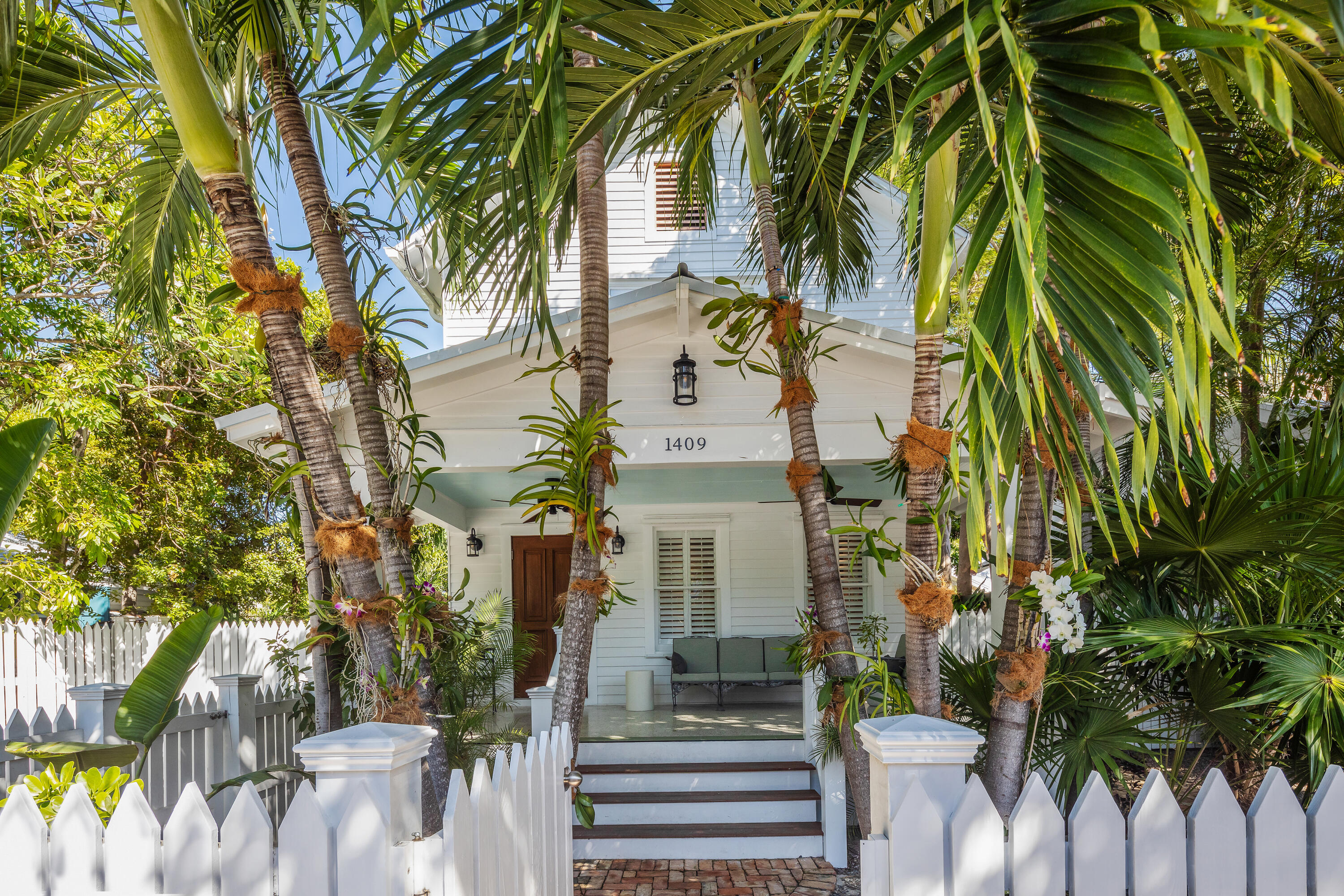 1409 White Street Key West, FL 33040 - Photo 1 of 1 a view of a palm trees front of house