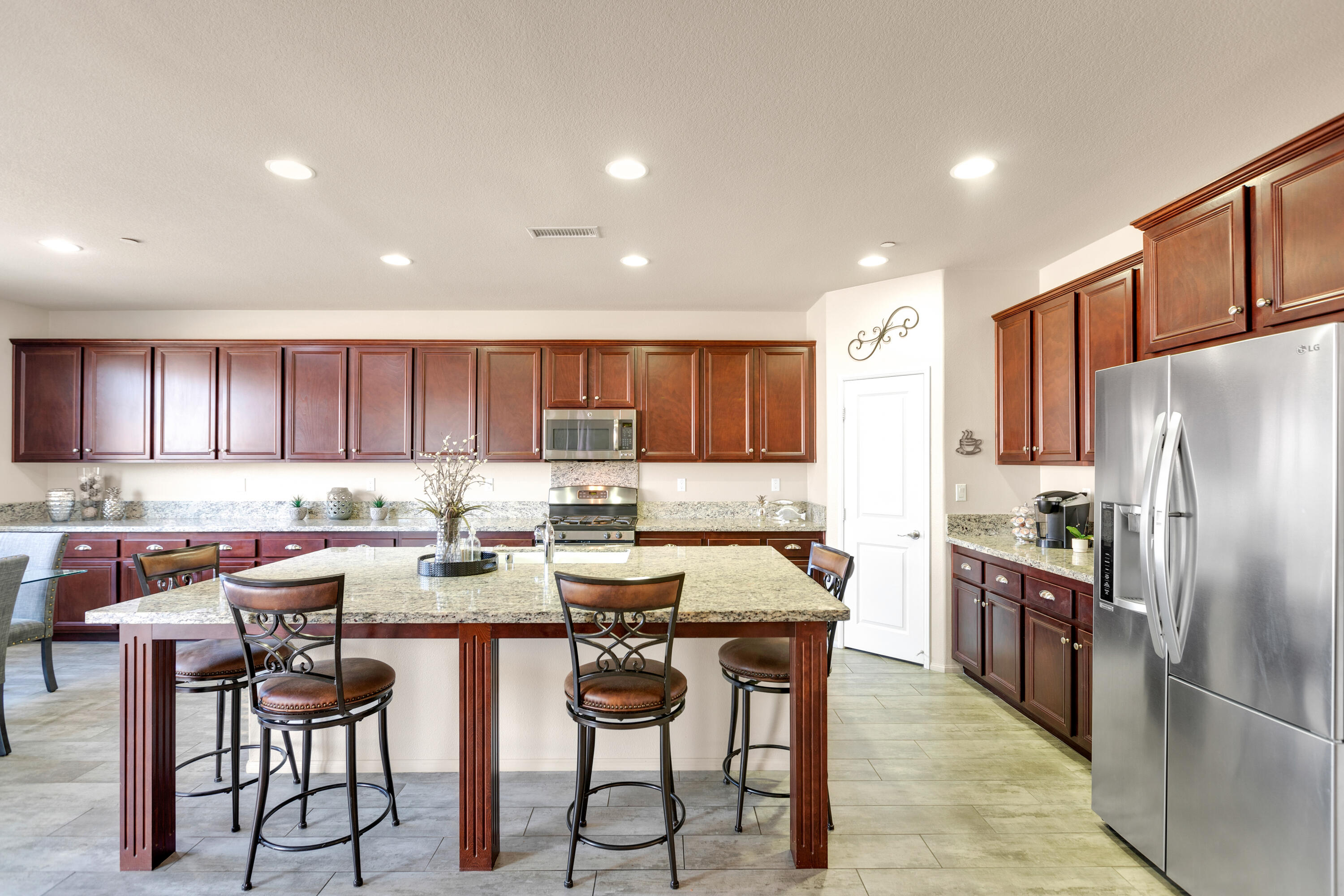 41344 Winfield Court Indio, CA 92203 - Photo 14 of 69 a kitchen with lots of counter top space and appliances