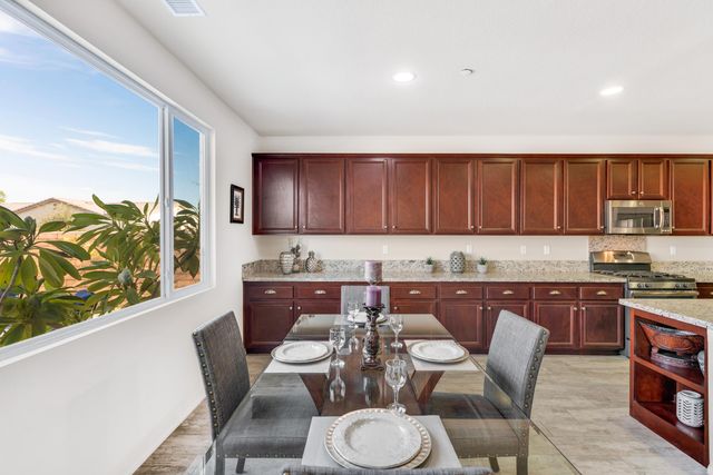 a aerial view of a house with a yard and potted plants