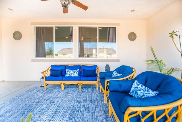 a bedroom with a large bed and glass window
