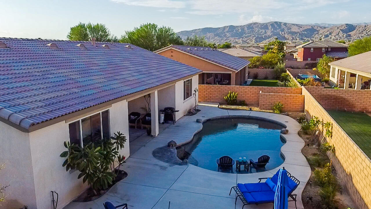 41344 Winfield Court Indio, CA 92203 - Photo 28 of 69 a aerial view of a house with a yard and potted plants