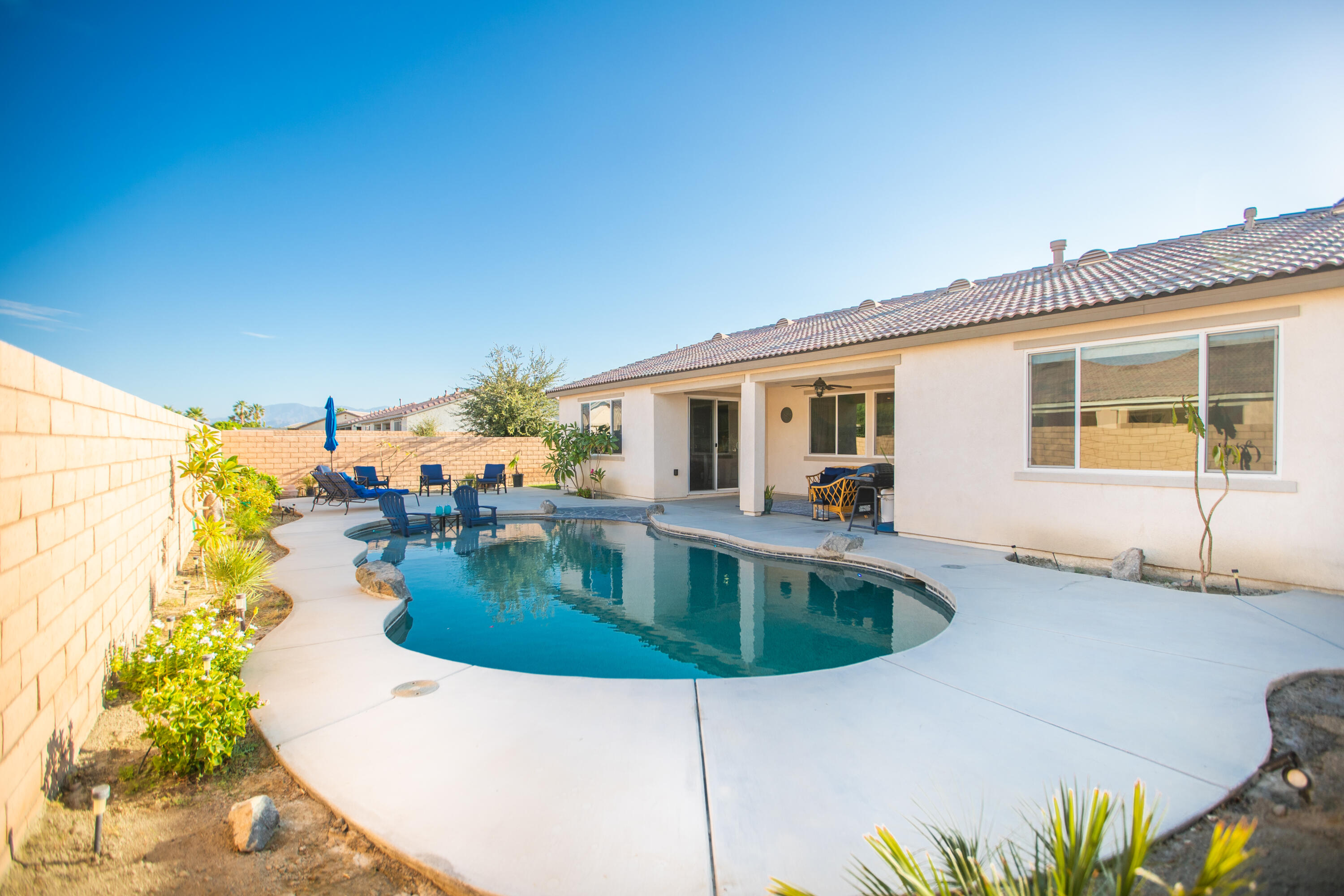 41344 Winfield Court Indio, CA 92203 - Photo 33 of 69 a view of a house with swimming pool