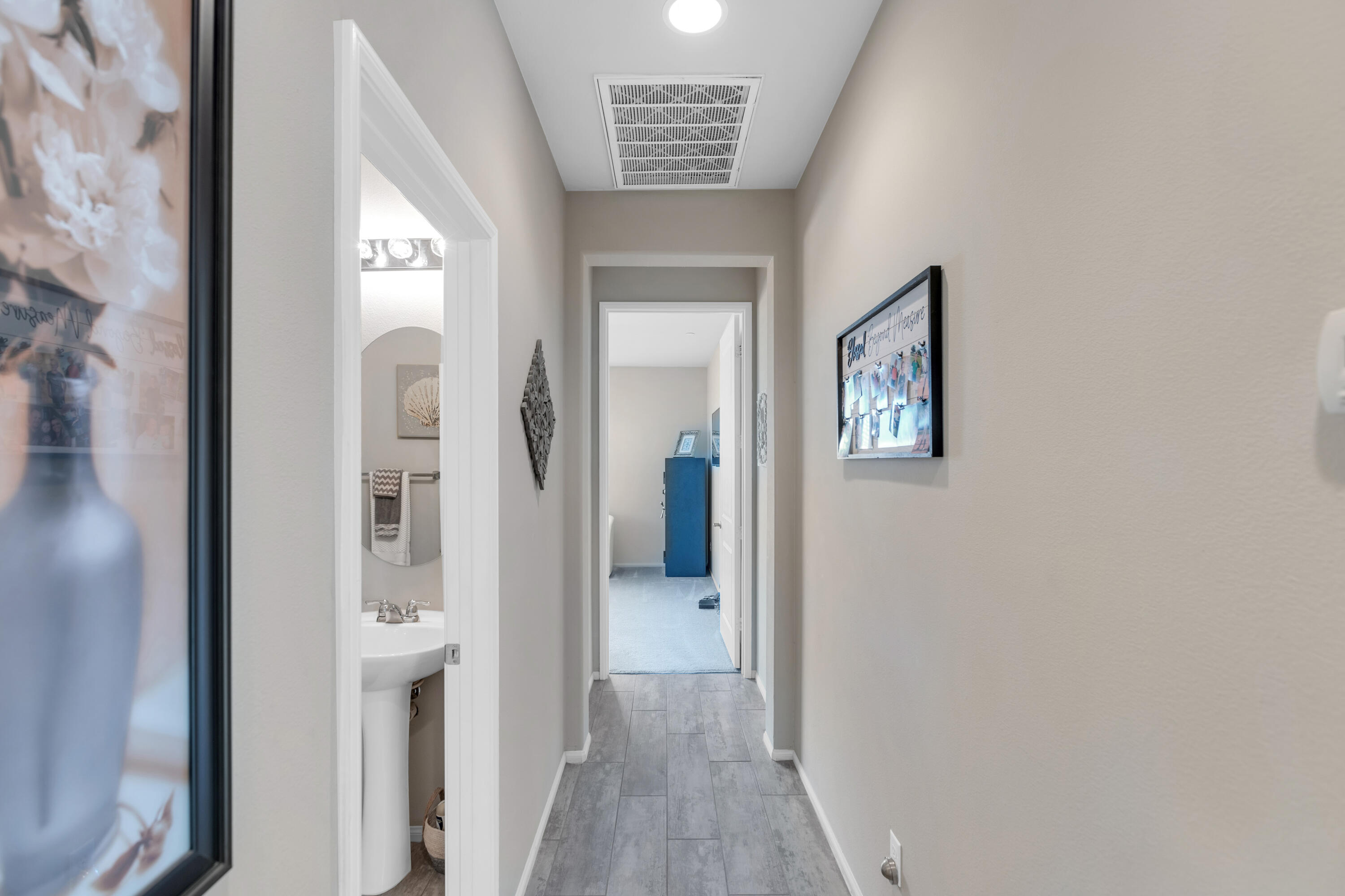 41344 Winfield Court Indio, CA 92203 - Photo 35 of 69 view of a hallway with wooden floor and a living room