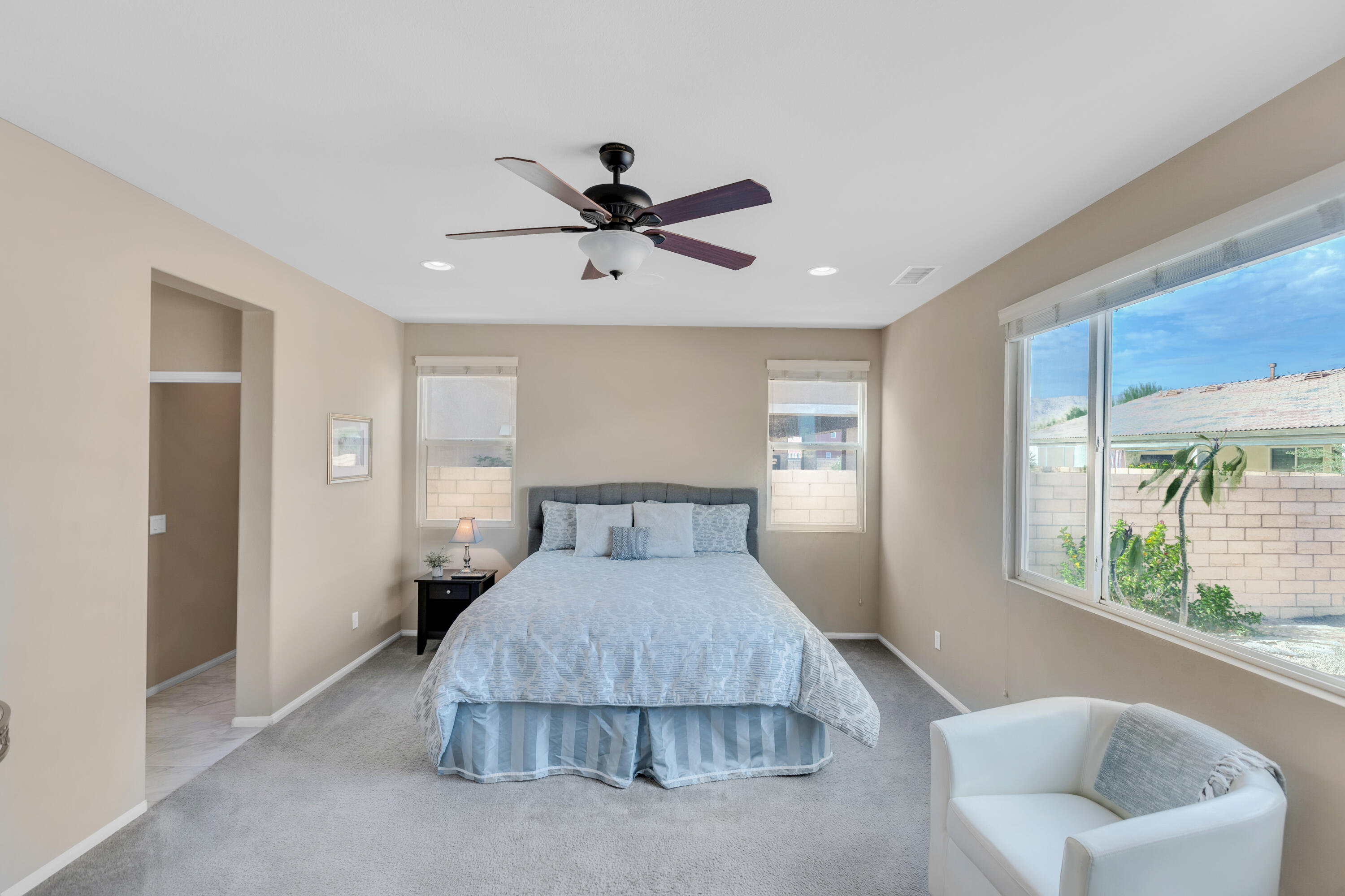 41344 Winfield Court Indio, CA 92203 - Photo 38 of 69 a bedroom with a large bed and glass window