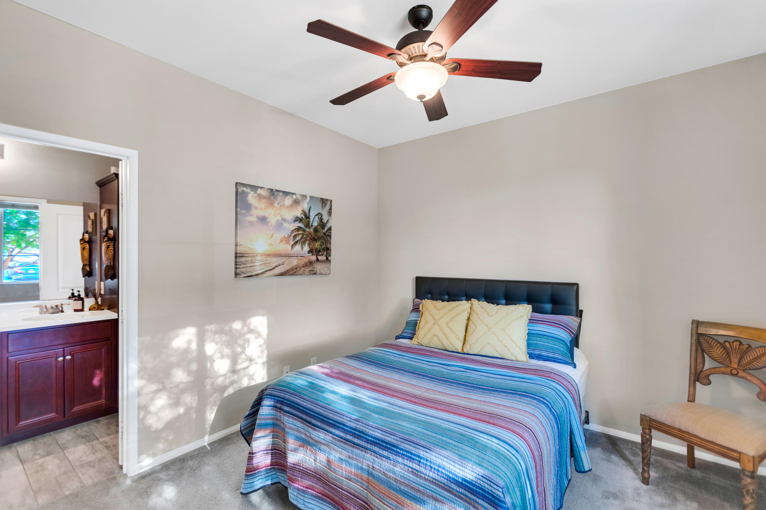 41344 Winfield Court Indio, CA 92203 - Photo 46 of 69 a bedroom with a bed and a chandelier