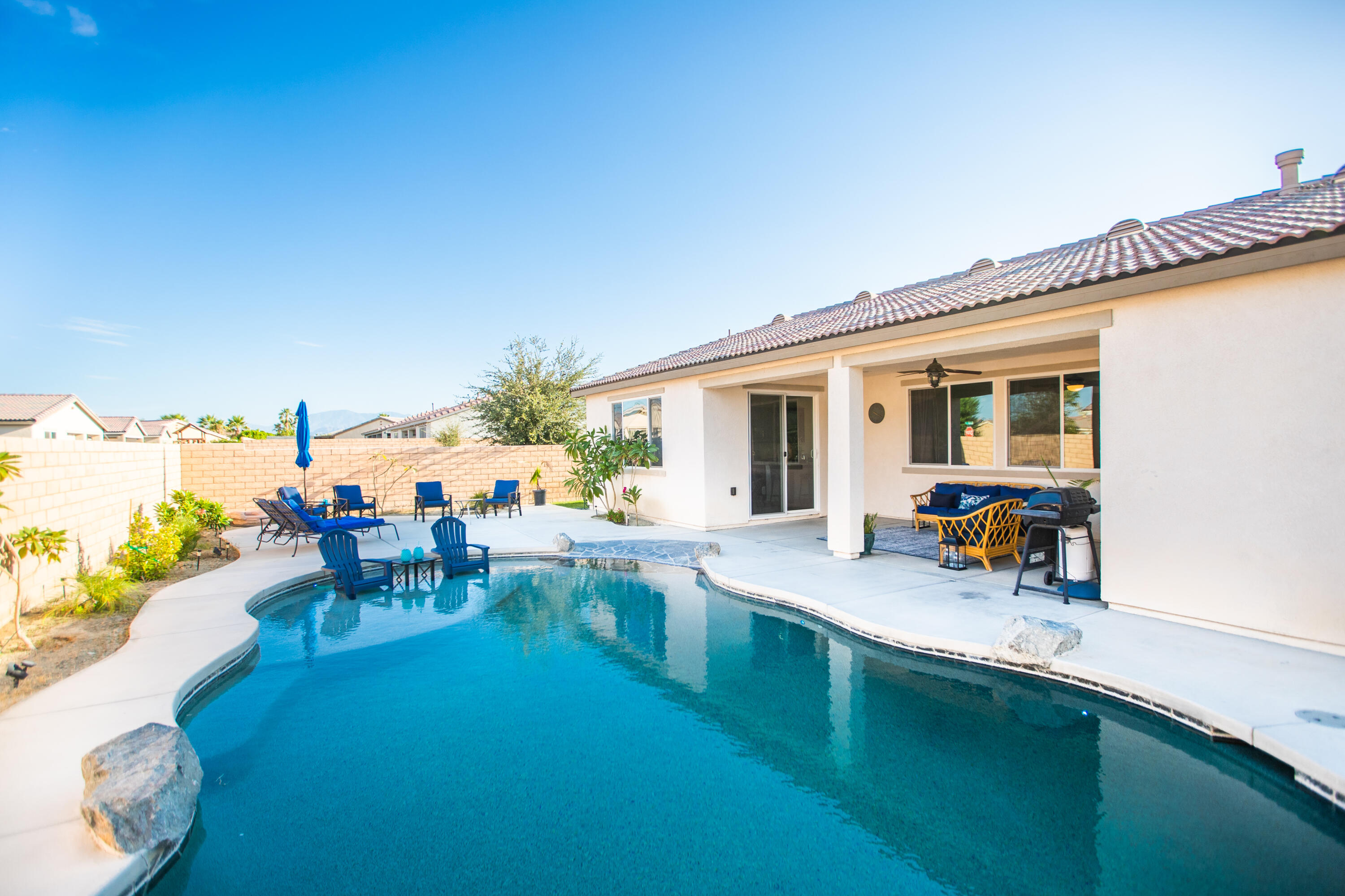 41344 Winfield Court Indio, CA 92203 - Photo 51 of 69 a view of a swimming pool with chairs