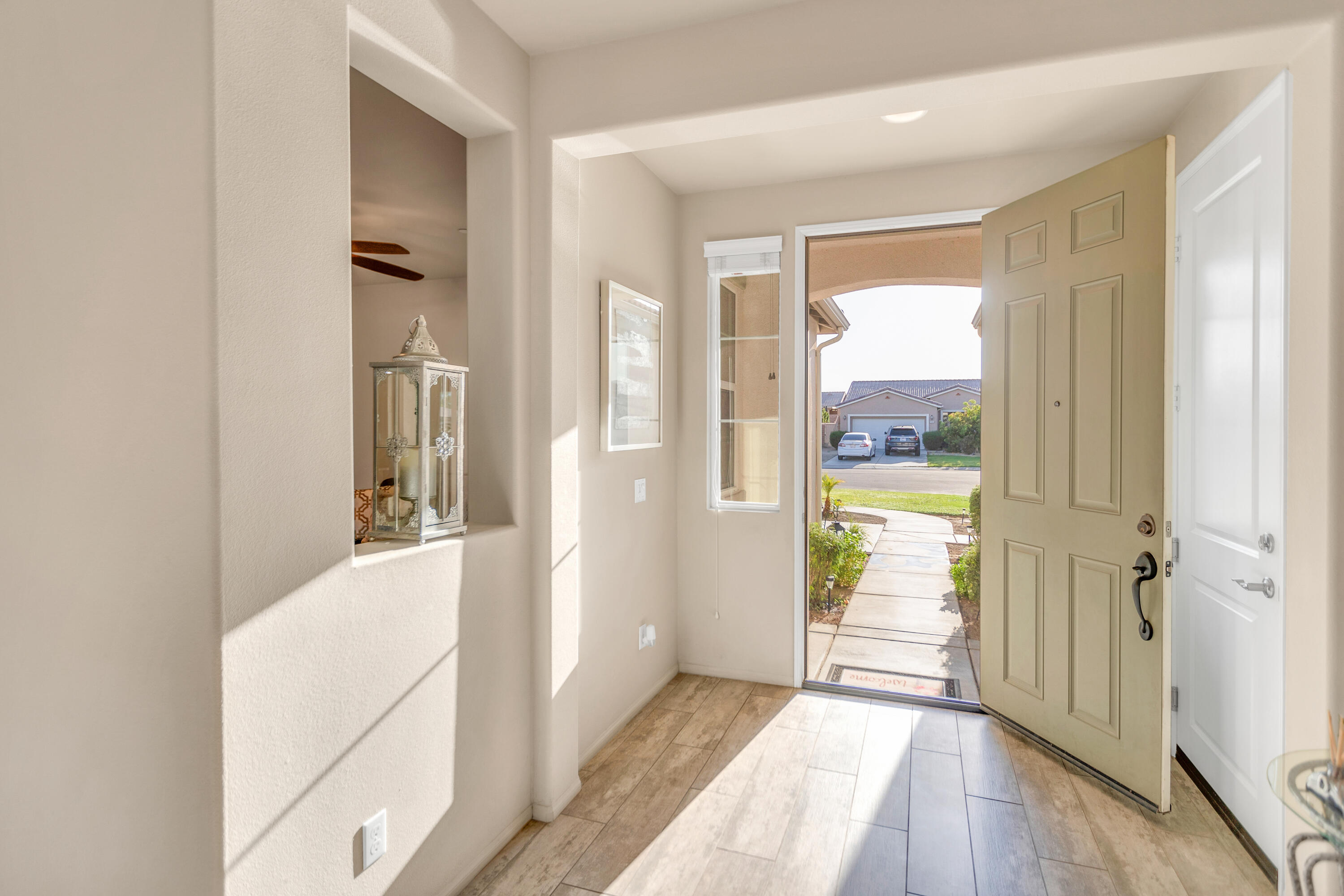 41344 Winfield Court Indio, CA 92203 - Photo 10 of 69 a view of a hallway with wooden floor and a dining room