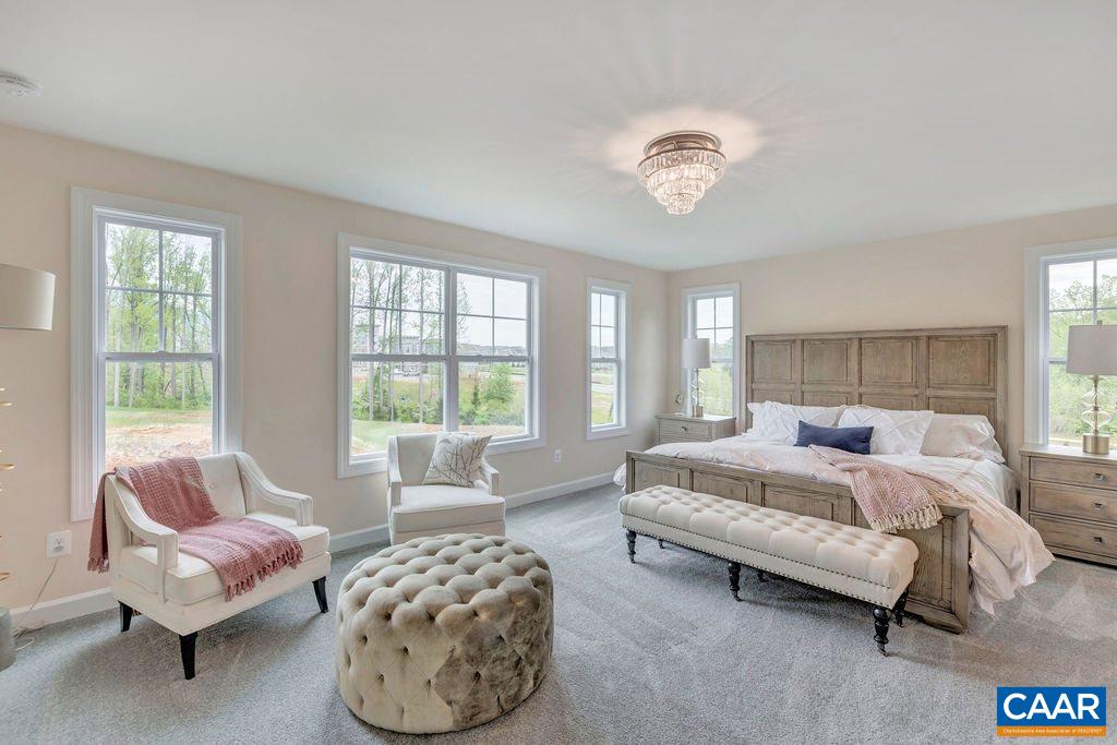 3264 Thicket Run Drive Charlottesville, VA 22911 - Photo 12 of 25 a spacious bedroom with a bed and a couch
