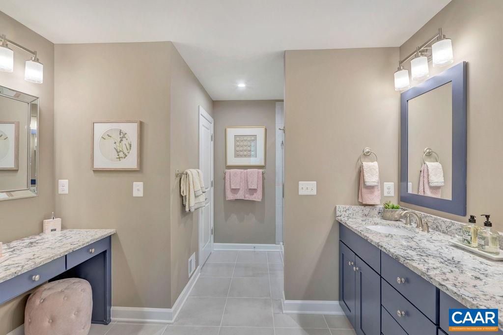3264 Thicket Run Drive Charlottesville, VA 22911 - Photo 13 of 25 a bathroom with a granite countertop sink and a mirror