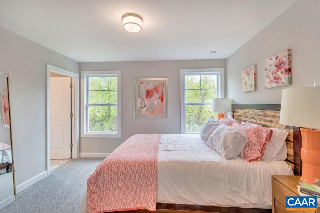 3264 Thicket Run Drive Charlottesville, VA 22911 - Photo 16 of 25 a bedroom with a bed and a window