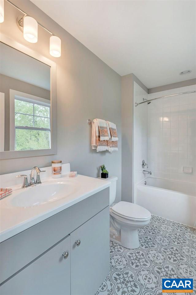 3264 Thicket Run Drive Charlottesville, VA 22911 - Photo 17 of 25 a bathroom with a sink a toilet and shower