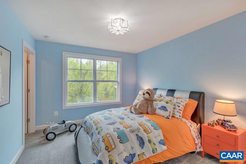 3264 Thicket Run Drive Charlottesville, VA 22911 - Photo 18 of 25 a bedroom with a bed and a window