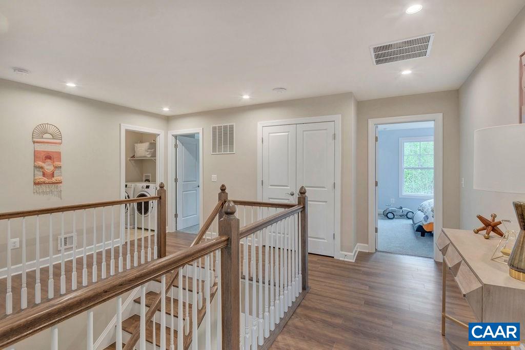 3264 Thicket Run Drive Charlottesville, VA 22911 - Photo 20 of 25 a view of a hallway with wooden floor and windows