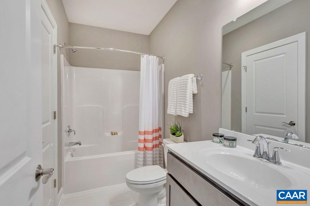 3264 Thicket Run Drive Charlottesville, VA 22911 - Photo 22 of 25 a bathroom with a sink toilet vanity and shower