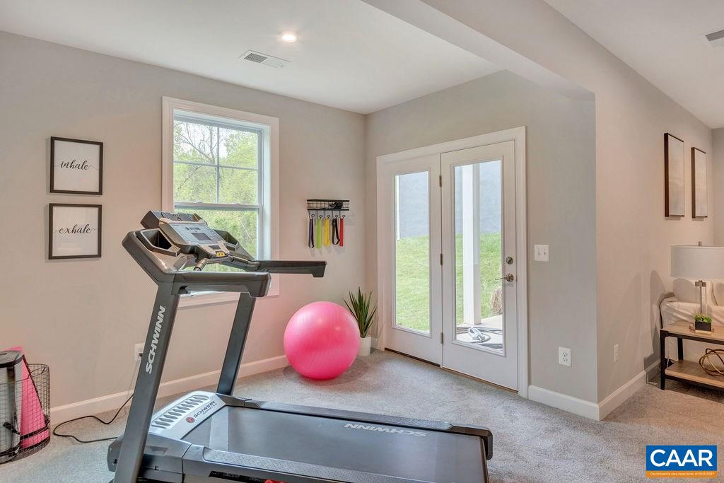 3264 Thicket Run Drive Charlottesville, VA 22911 - Photo 23 of 25 a view of a livingroom with furniture and a window