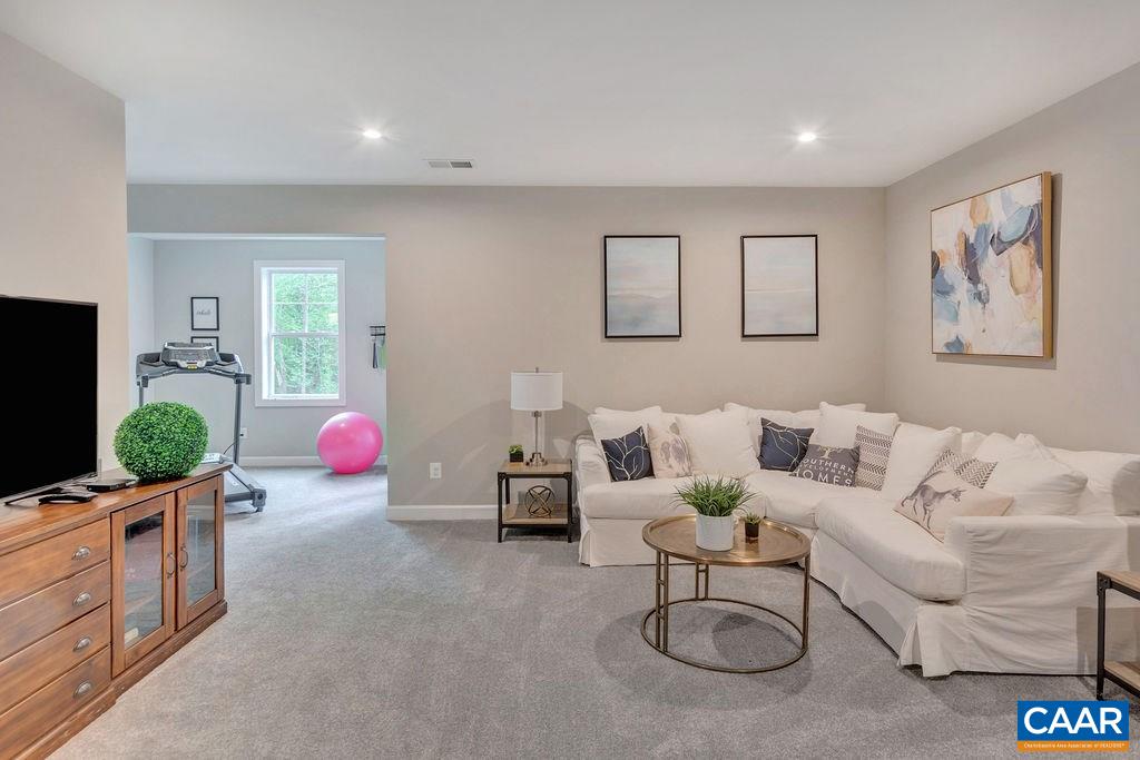 3264 Thicket Run Drive Charlottesville, VA 22911 - Photo 25 of 25 a living room with furniture and a flat screen tv