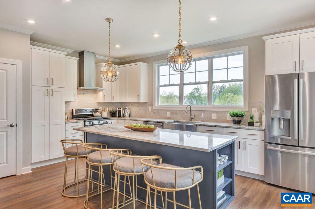 3264 Thicket Run Drive Charlottesville, VA 22911 - Photo 9 of 25 a kitchen with a sink a center island stainless steel appliances and cabinets