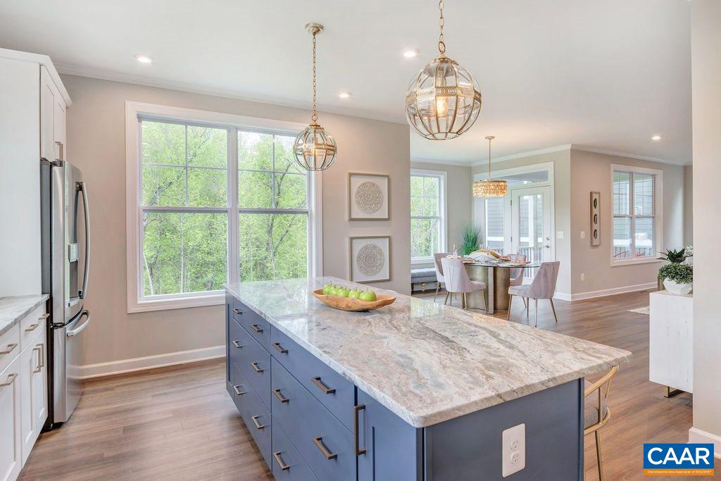 3264 Thicket Run Drive Charlottesville, VA 22911 - Photo 10 of 25 a kitchen with stainless steel appliances granite countertop counter space and a chandelier
