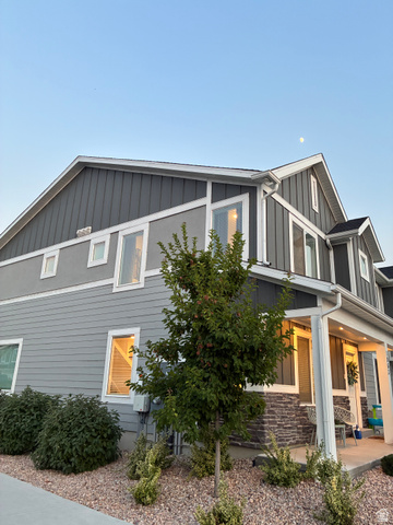 673 West 1920 South, Unit 1063 Provo, UT 84601 - Photo 3 of 15 Contemporary multi-story facade featuring mixed siding, stone veneer accents, white trim, and multiple windows