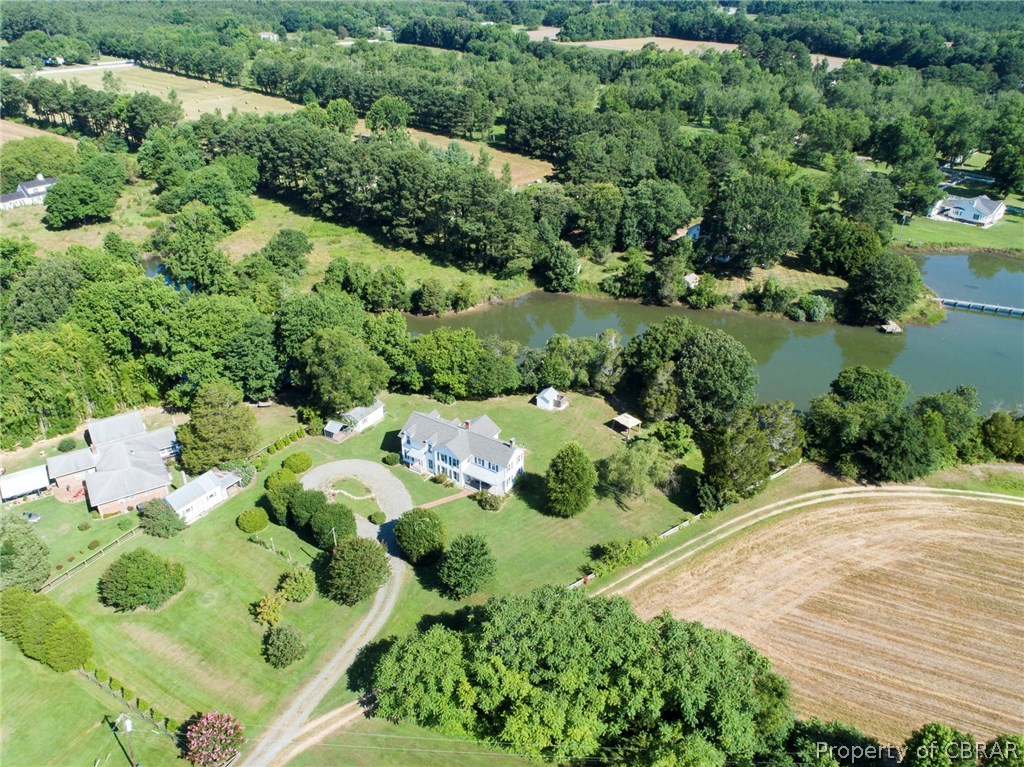 277 Mill Lane Road Cardinal, VA 23025 - Photo 2 of 47 an aerial view of green landscape with trees houses and lake view