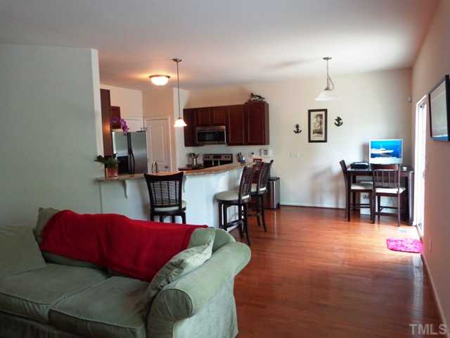 5139 Arbor Chase Drive Raleigh, NC 27616 - Photo 12 of 25 a living room with furniture and a kitchen view