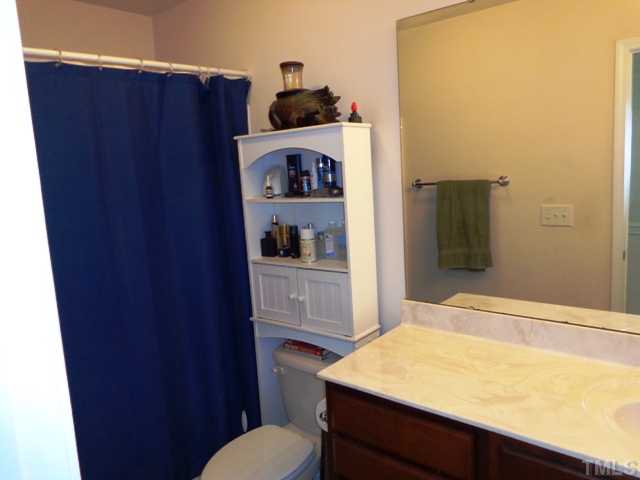5139 Arbor Chase Drive Raleigh, NC 27616 - Photo 15 of 25 a bathroom with a sink and a toilet