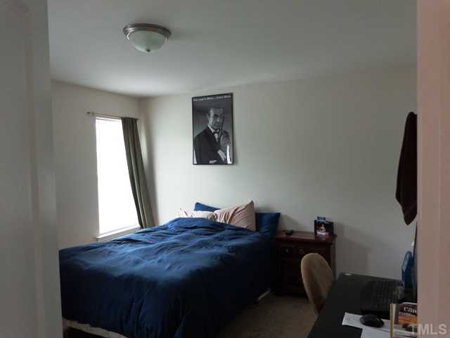 5139 Arbor Chase Drive Raleigh, NC 27616 - Photo 19 of 25 a bedroom with a bed and a window