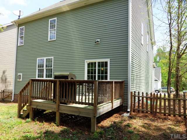 5139 Arbor Chase Drive Raleigh, NC 27616 - Photo 24 of 25 a view of a wooden house with a small yard and wooden fence