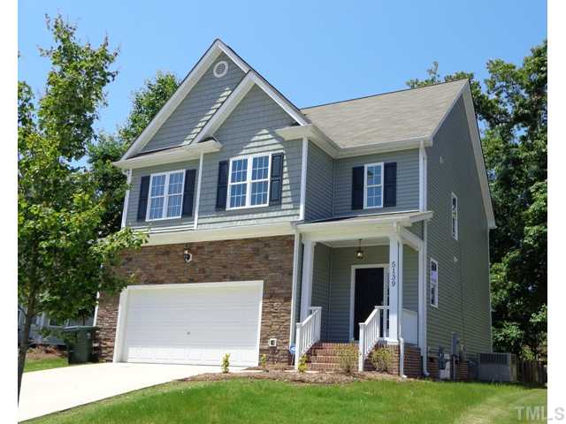 5139 Arbor Chase Drive Raleigh, NC 27616 - Photo 25 of 25 a front view of a house with a yard and garage