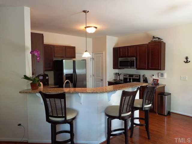 5139 Arbor Chase Drive Raleigh, NC 27616 - Photo 5 of 25 a view of kitchen with cabinets and wooden floor