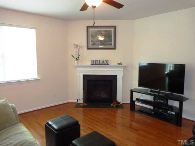5139 Arbor Chase Drive Raleigh, NC 27616 - Photo 9 of 25 a living room with furniture and a flat screen tv