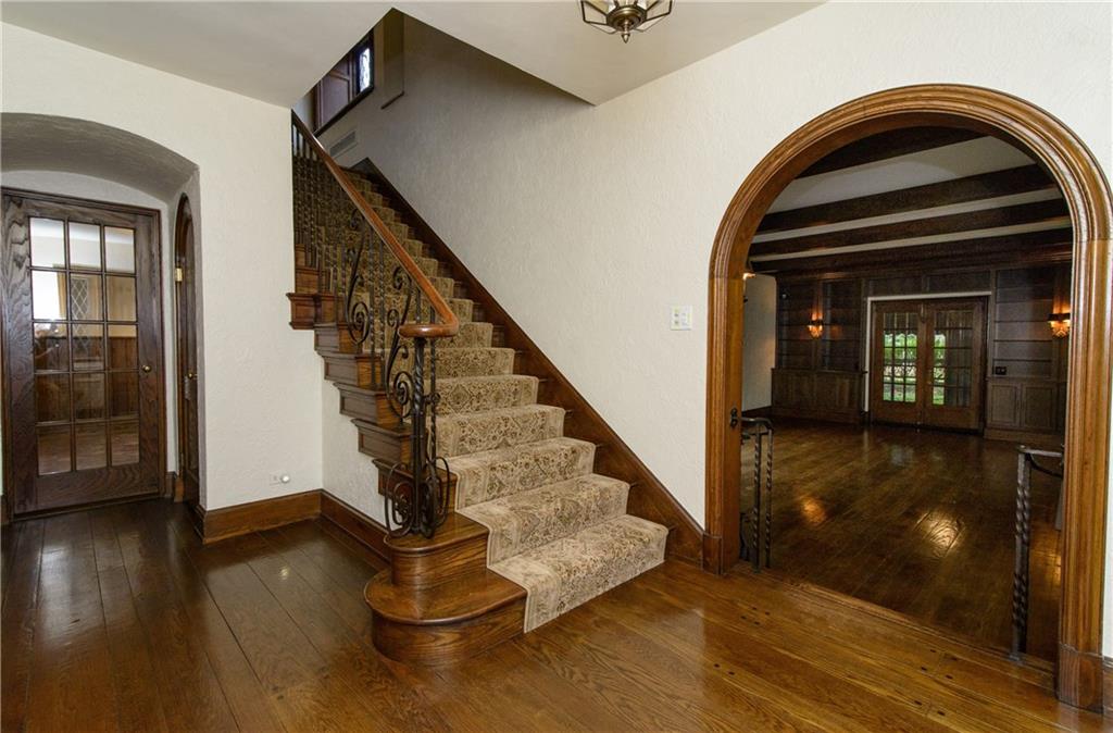 21 Newgate Road Pittsburgh, PA 15202 - Photo 3 of 25 Welcome your guests into this stunning foyer. The architectural detail in this home is extraordinary, with arched doorways and iron railings.
