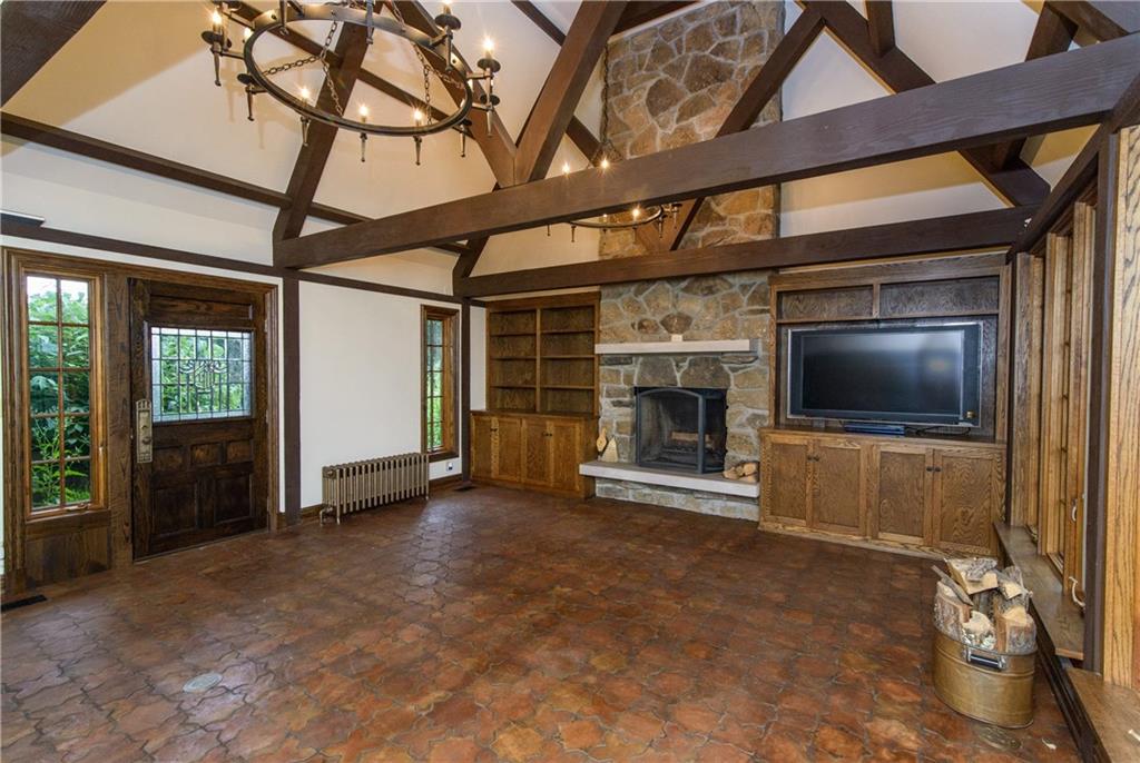 21 Newgate Road Pittsburgh, PA 15202 - Photo 5 of 25 The Restoration Hardware wrought iron Tudor style chandeliers are the perfect accent to the beamed ceiling. This room features custom handmade French terra cotta flooring with programmable electric heating .