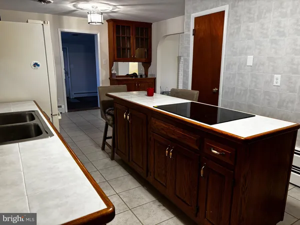 a kitchen with a sink and a refrigerator
