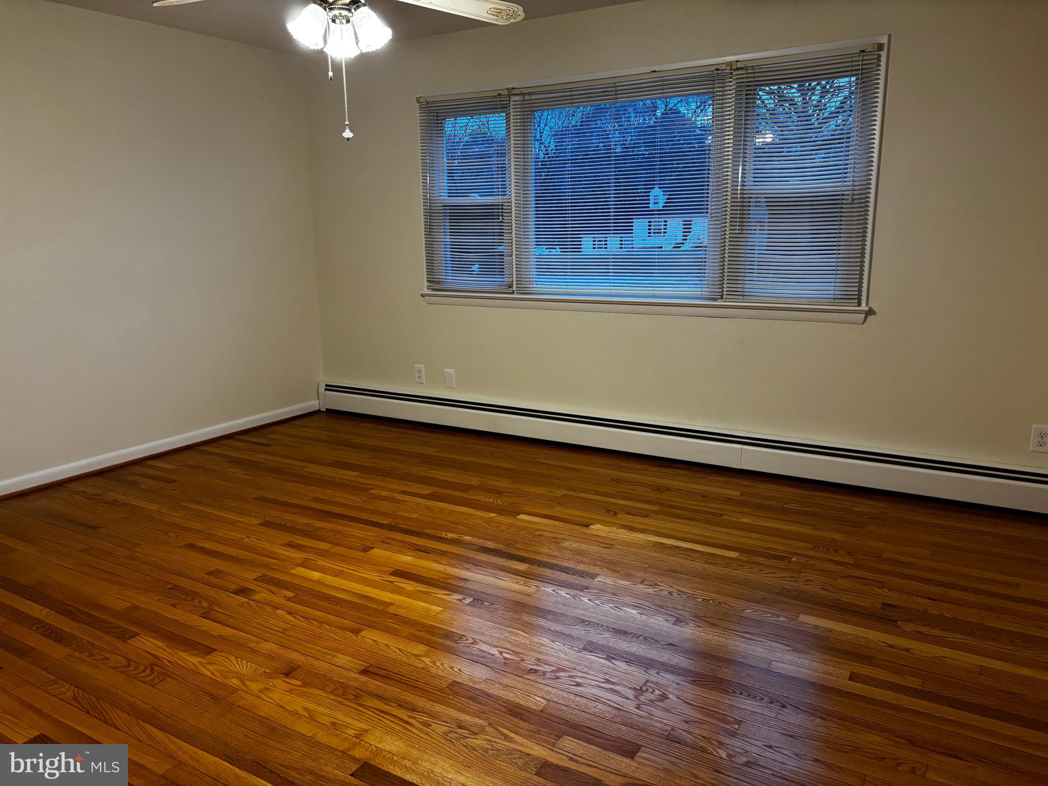 23230 Colton Point Road Avenue, MD 20609 - Photo 25 of 44 a view of an empty room with wooden floor and a window