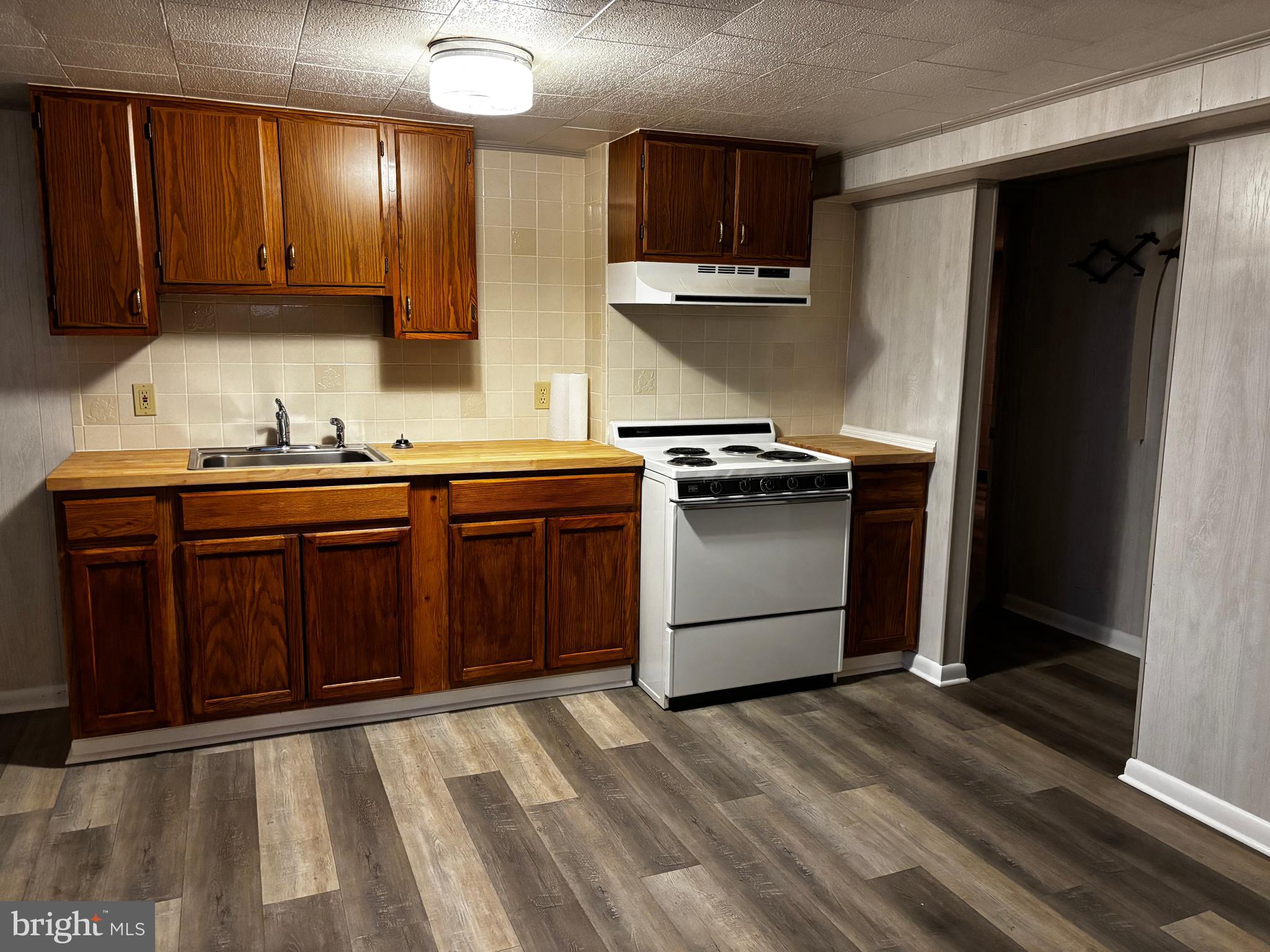 23230 Colton Point Road Avenue, MD 20609 - Photo 35 of 44 a kitchen with stainless steel appliances granite countertop a stove a sink and a refrigerator