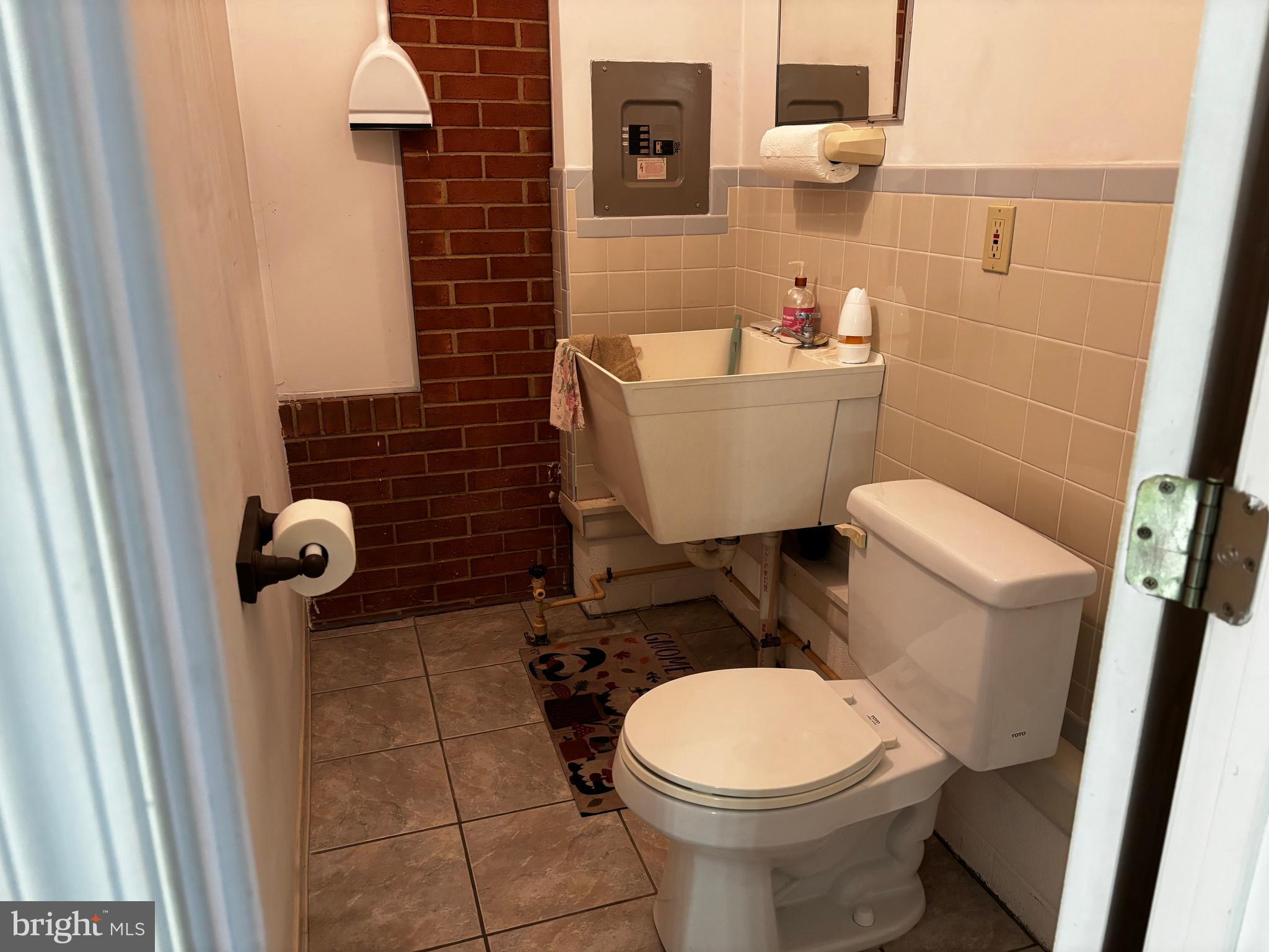 23230 Colton Point Road Avenue, MD 20609 - Photo 43 of 44 a bathroom with a toilet and a mirror