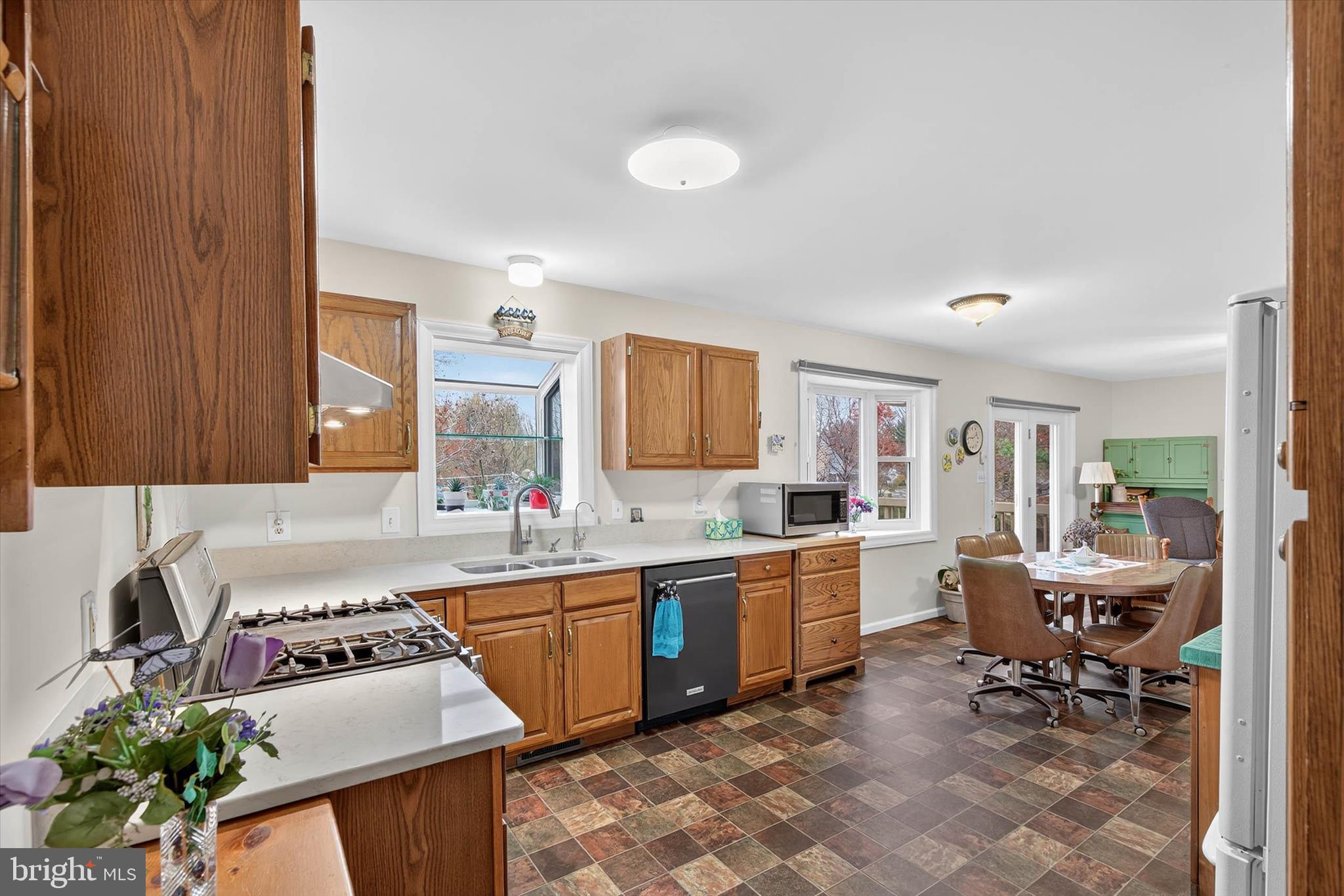 213 East 6th Street Lititz, PA 17543 - Photo 13 of 46 a kitchen with a sink stove and cabinets