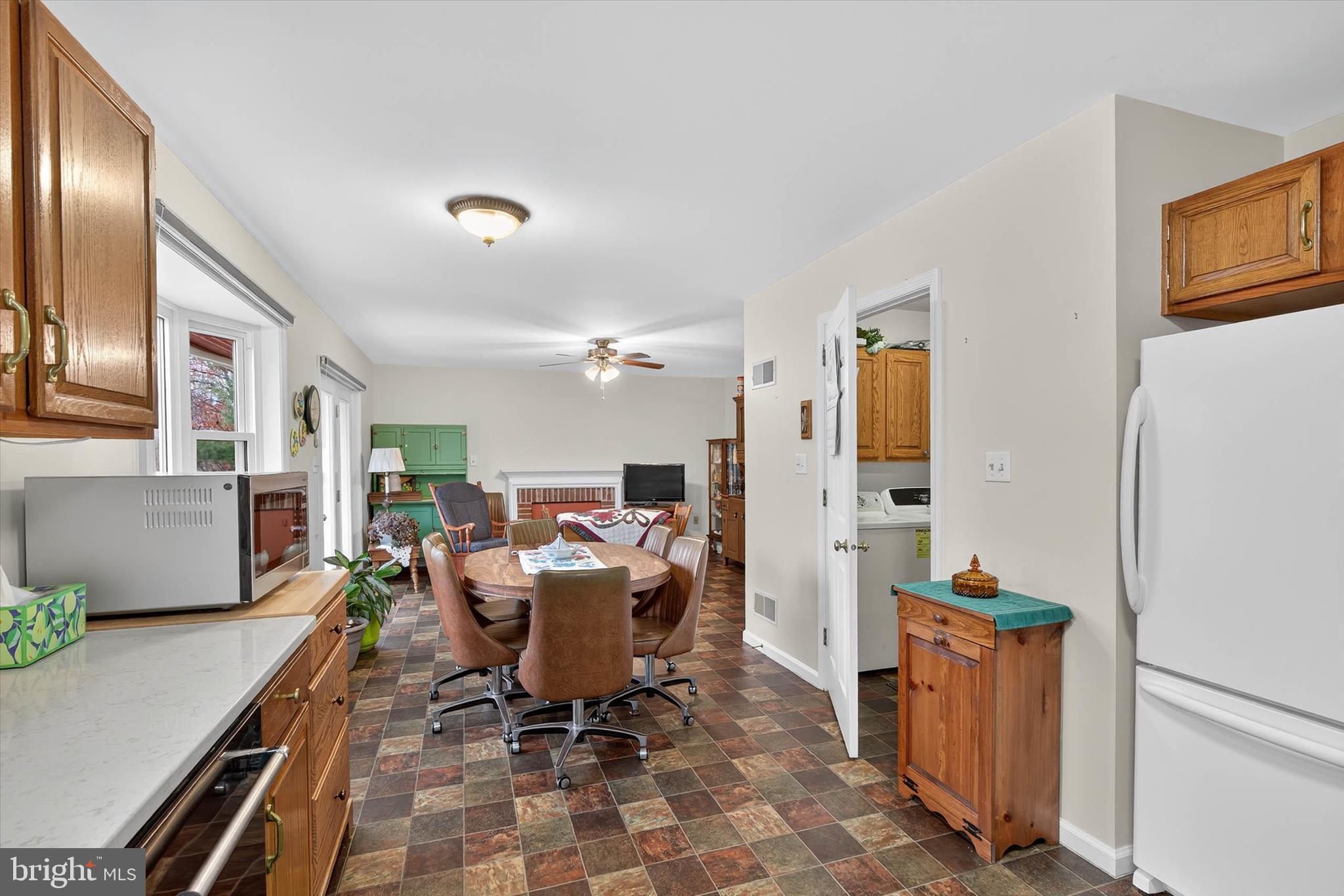 213 East 6th Street Lititz, PA 17543 - Photo 16 of 46 a dining room with furniture and a refrigerator
