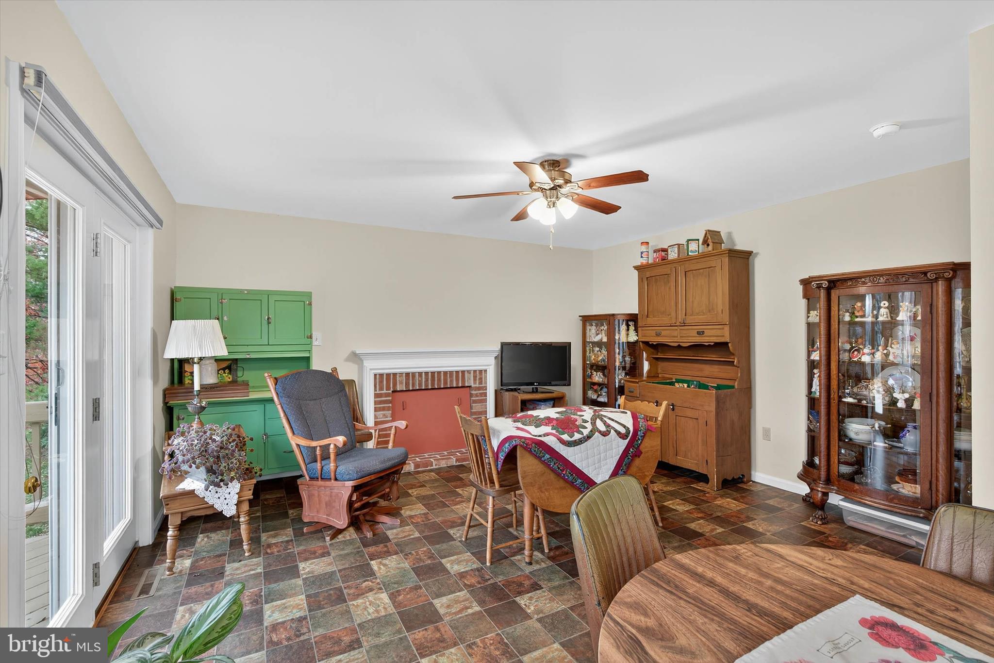 213 East 6th Street Lititz, PA 17543 - Photo 18 of 46 a living room with furniture a fireplace and a flat screen tv
