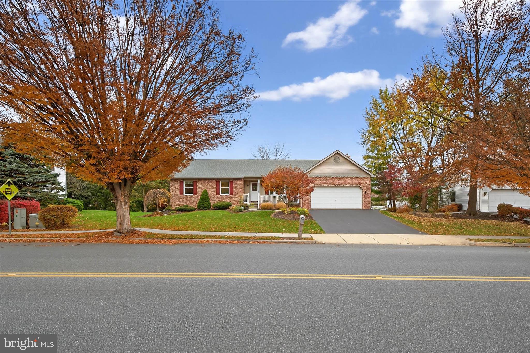 213 East 6th Street Lititz, PA 17543 - Photo 2 of 46 a front view of a house with a yard and large trees