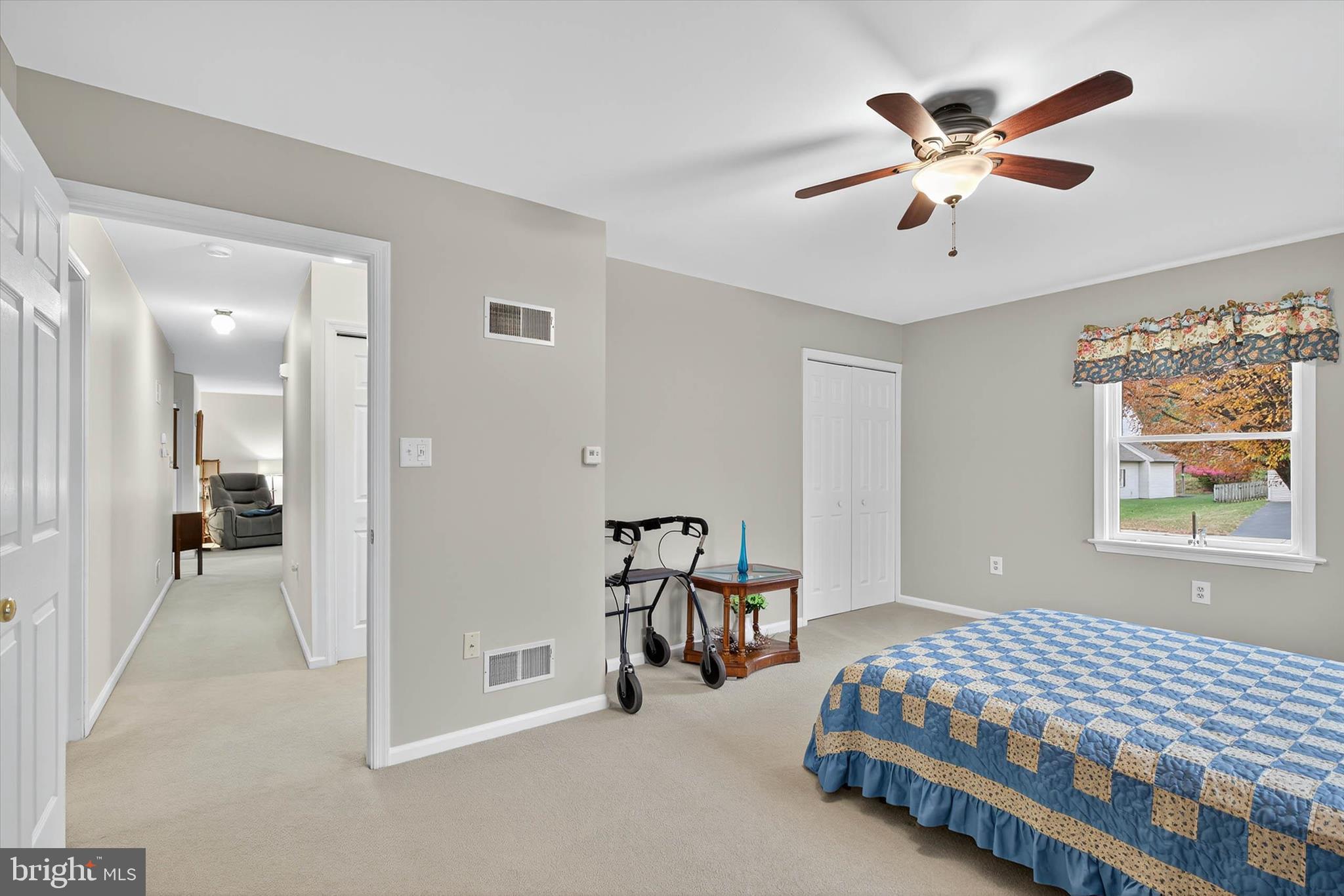 213 East 6th Street Lititz, PA 17543 - Photo 25 of 46 a spacious bedroom with a bed and a chandelier