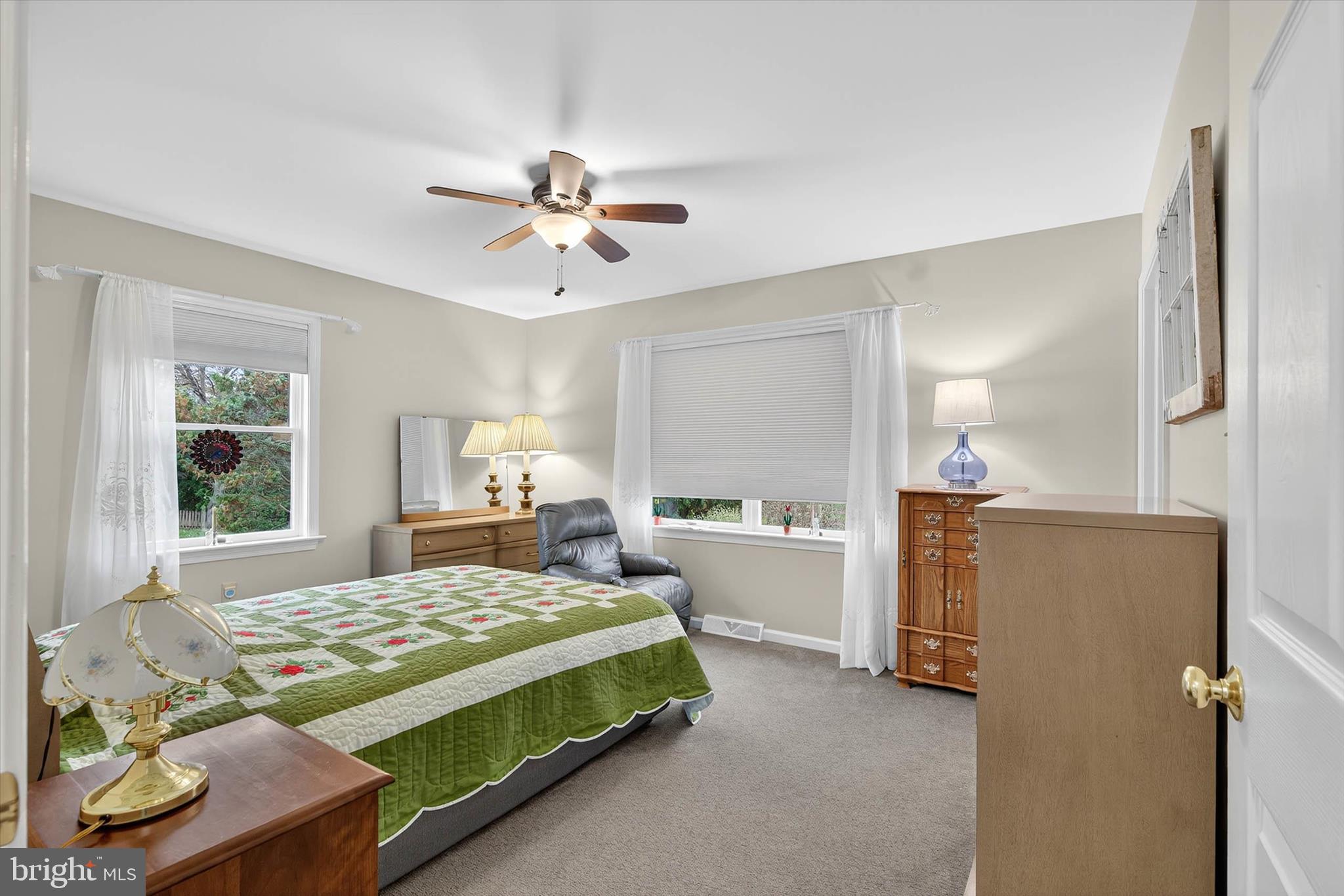 213 East 6th Street Lititz, PA 17543 - Photo 29 of 46 a bedroom with a bed and a chandelier