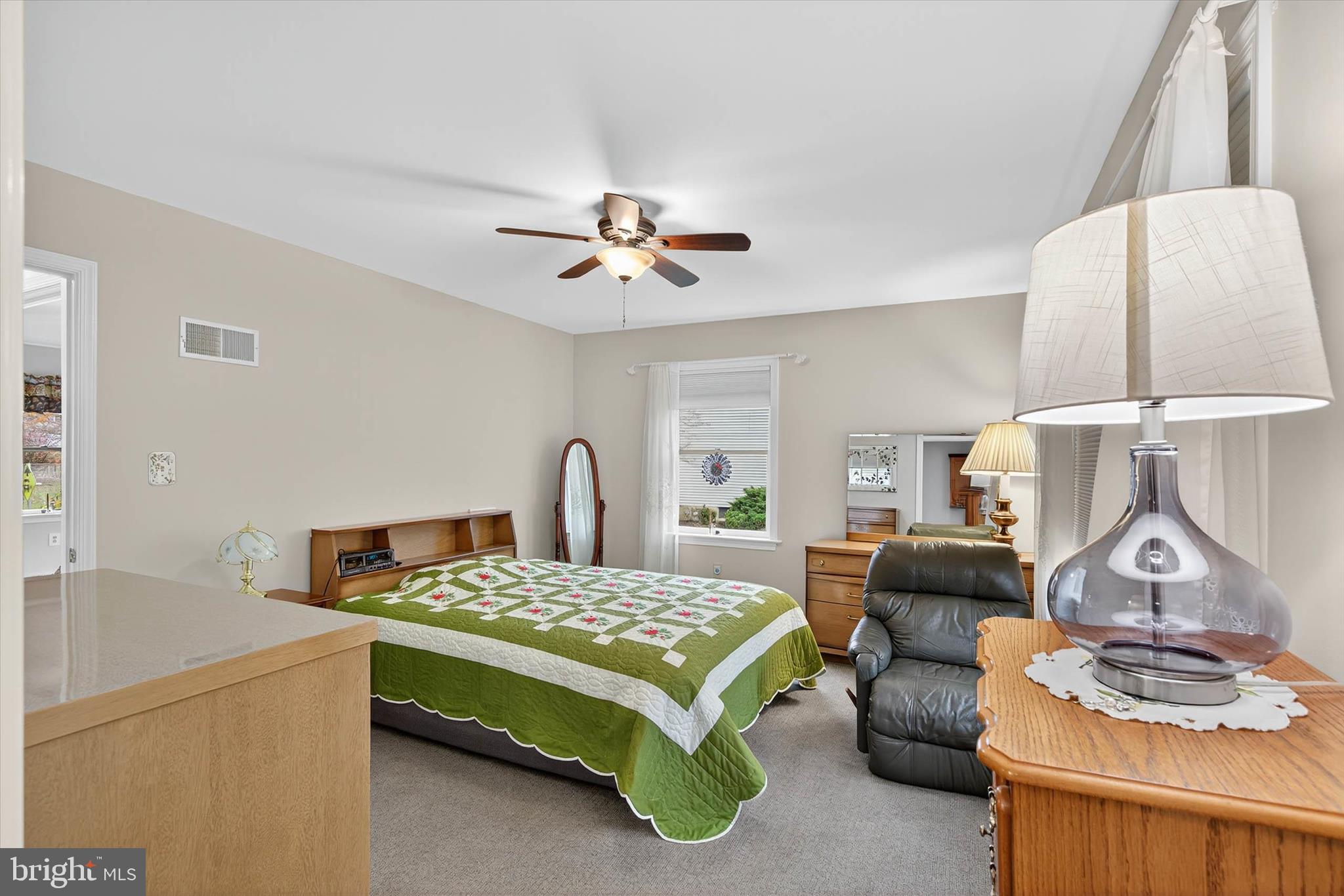 213 East 6th Street Lititz, PA 17543 - Photo 30 of 46 a bedroom with a bed and a table with lamp