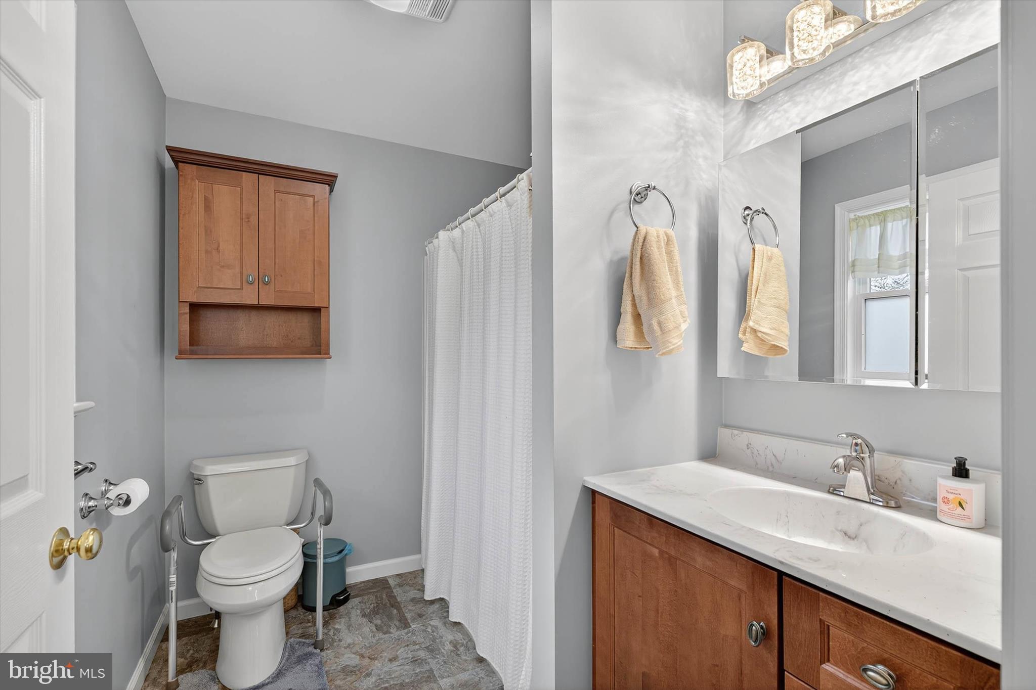 213 East 6th Street Lititz, PA 17543 - Photo 32 of 46 a bathroom with a toilet sink and mirror