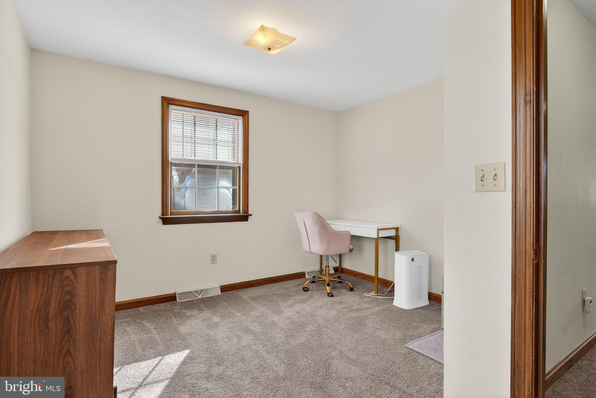 1007 East Walnut Street Lancaster, PA 17602 - Photo 24 of 35 a view of a workspace with furniture and a window