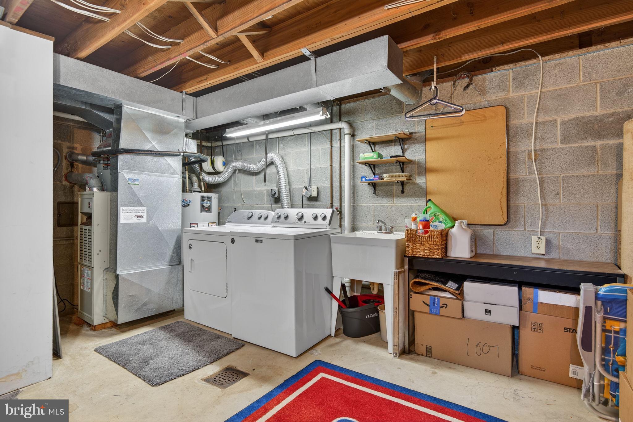 1007 East Walnut Street Lancaster, PA 17602 - Photo 29 of 35 a utility room with cabinets and washer